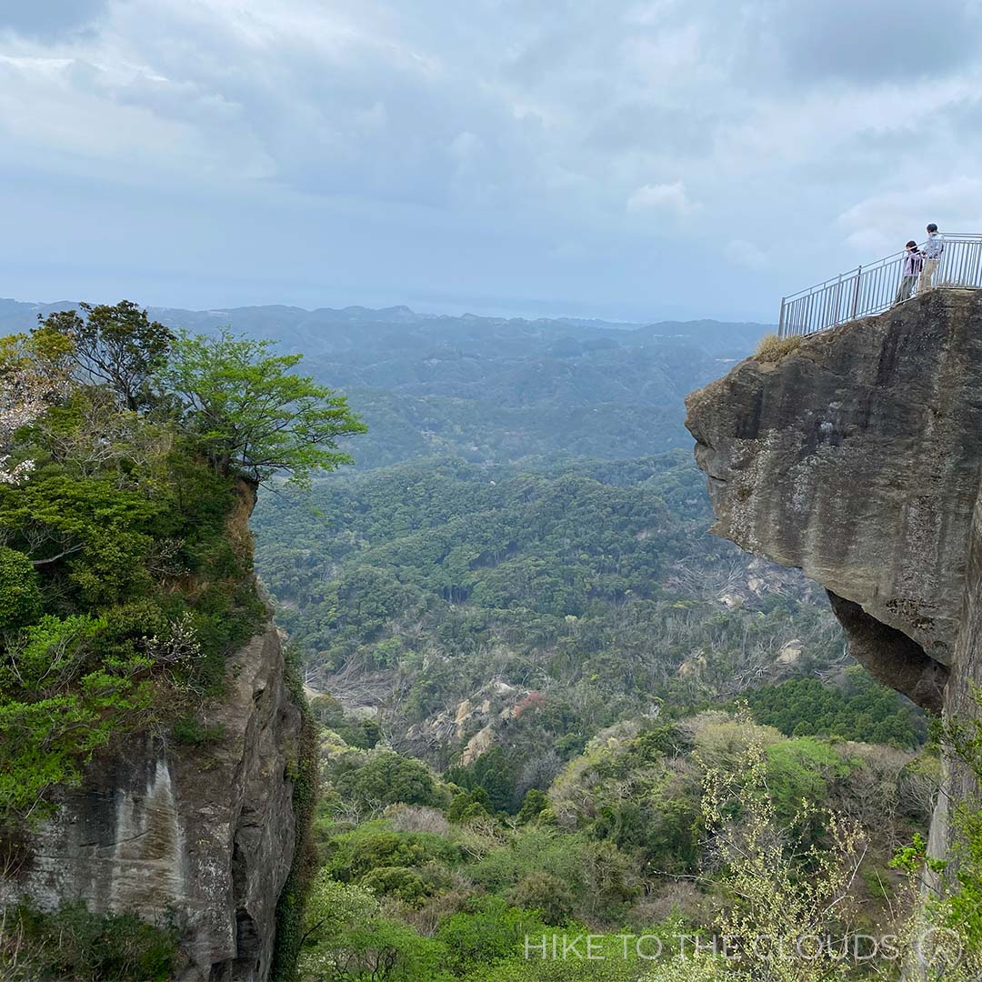 the stone cliff viewpoint that looks like an axe hanging over luscious woodland on Mount Nokogiri